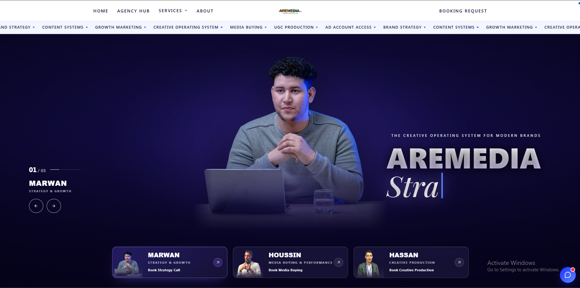 ARMEDIA desktop website with large title and team member behind a laptop